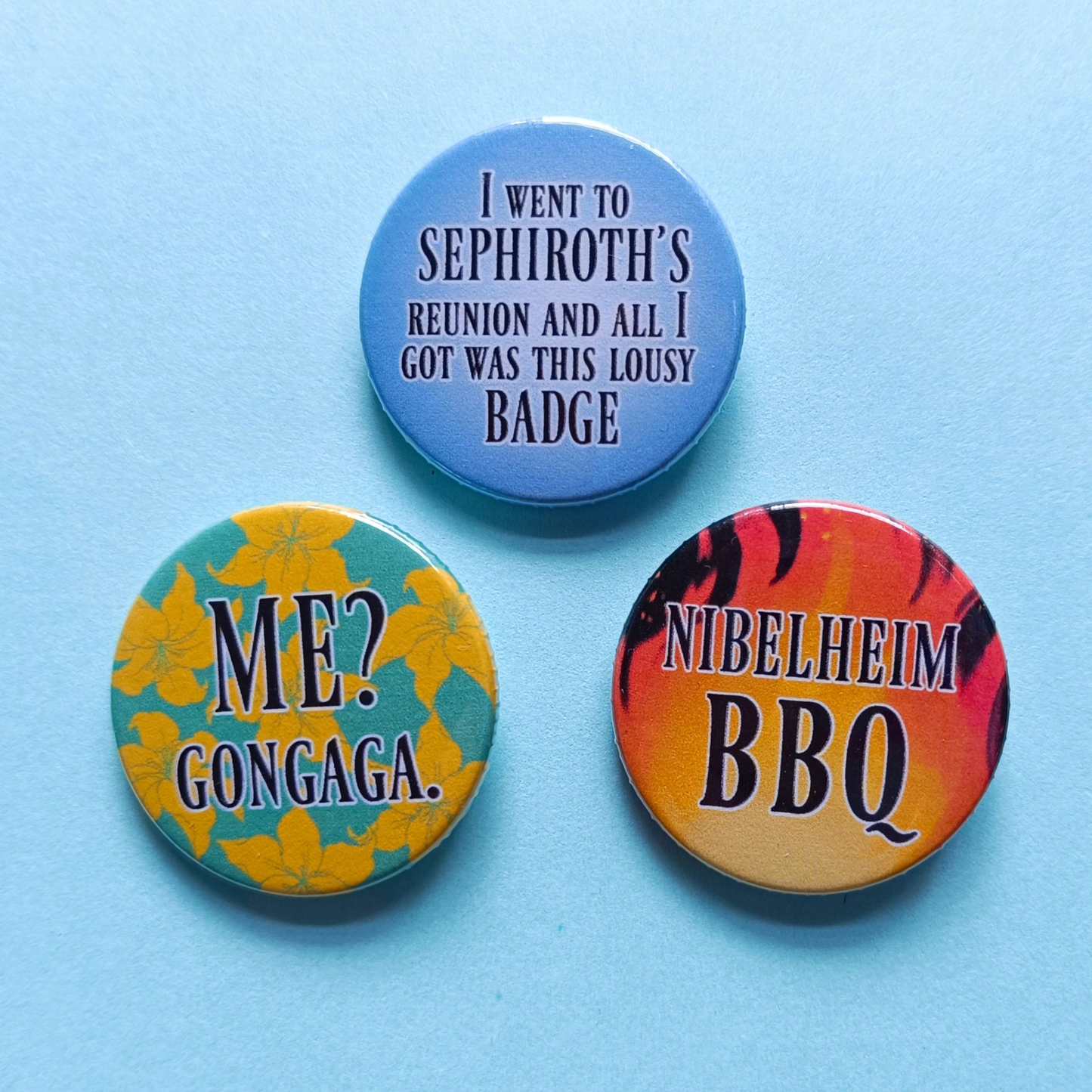 Final Fantasy 7 Rebirth badges. First badge says: I went to Sephiroth's reunion and all I got was this lousy badge. Second badge says: Nibelheim BBQ. Third badge says: Me? Gongaga.