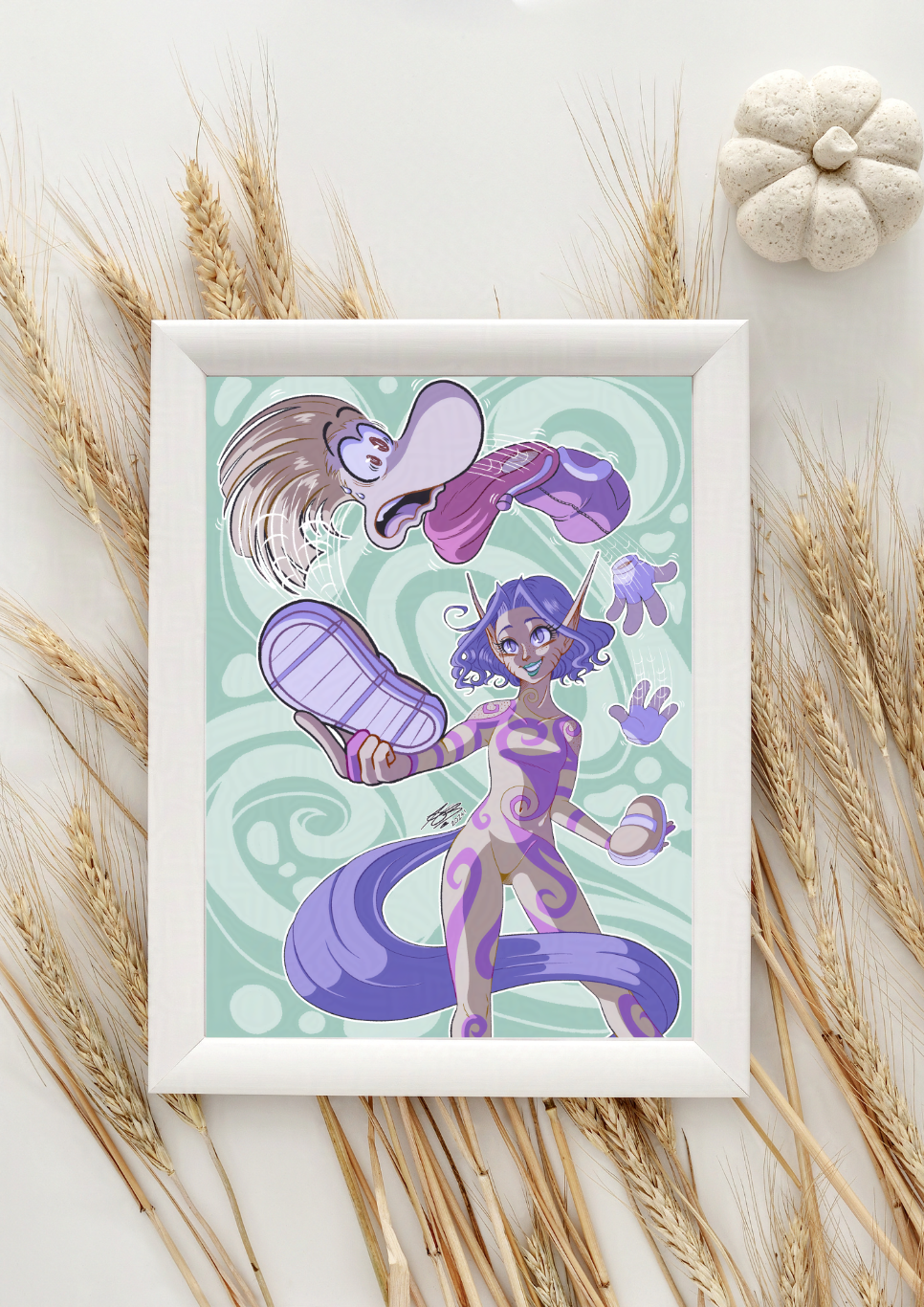 The aforementioned image in a mock up white frame with wheat decorating behind it.