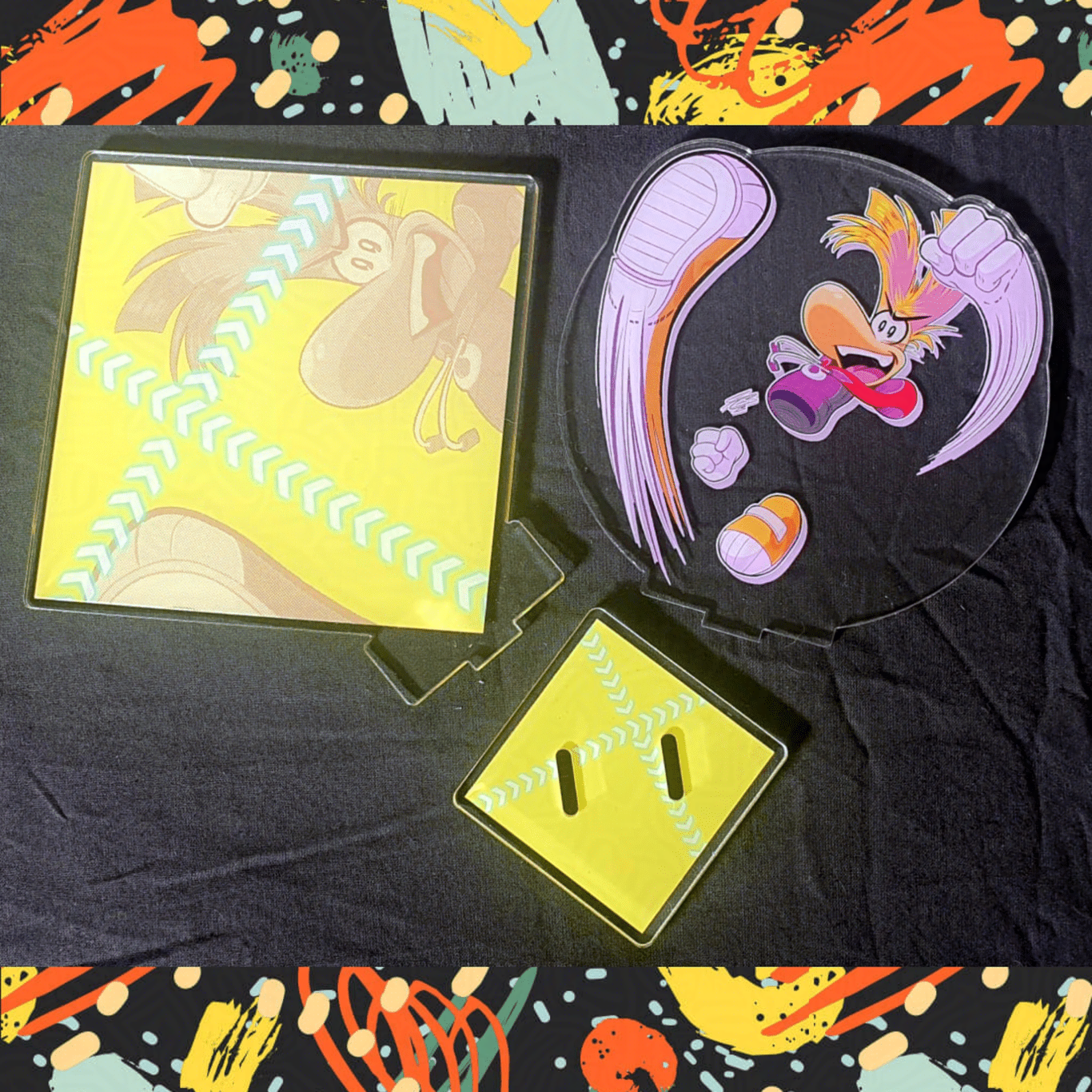 Photo of the 3 components that make of the Rayman acrylic standee.