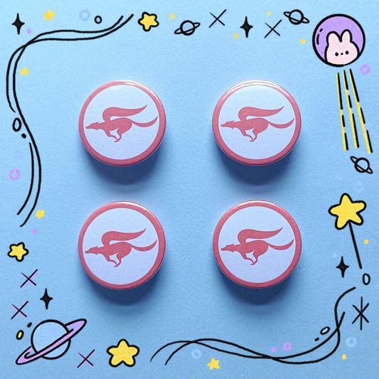 Photo of 4 button badges which feature the StarFox team logo in red with a very light blue background and a red circular frame.