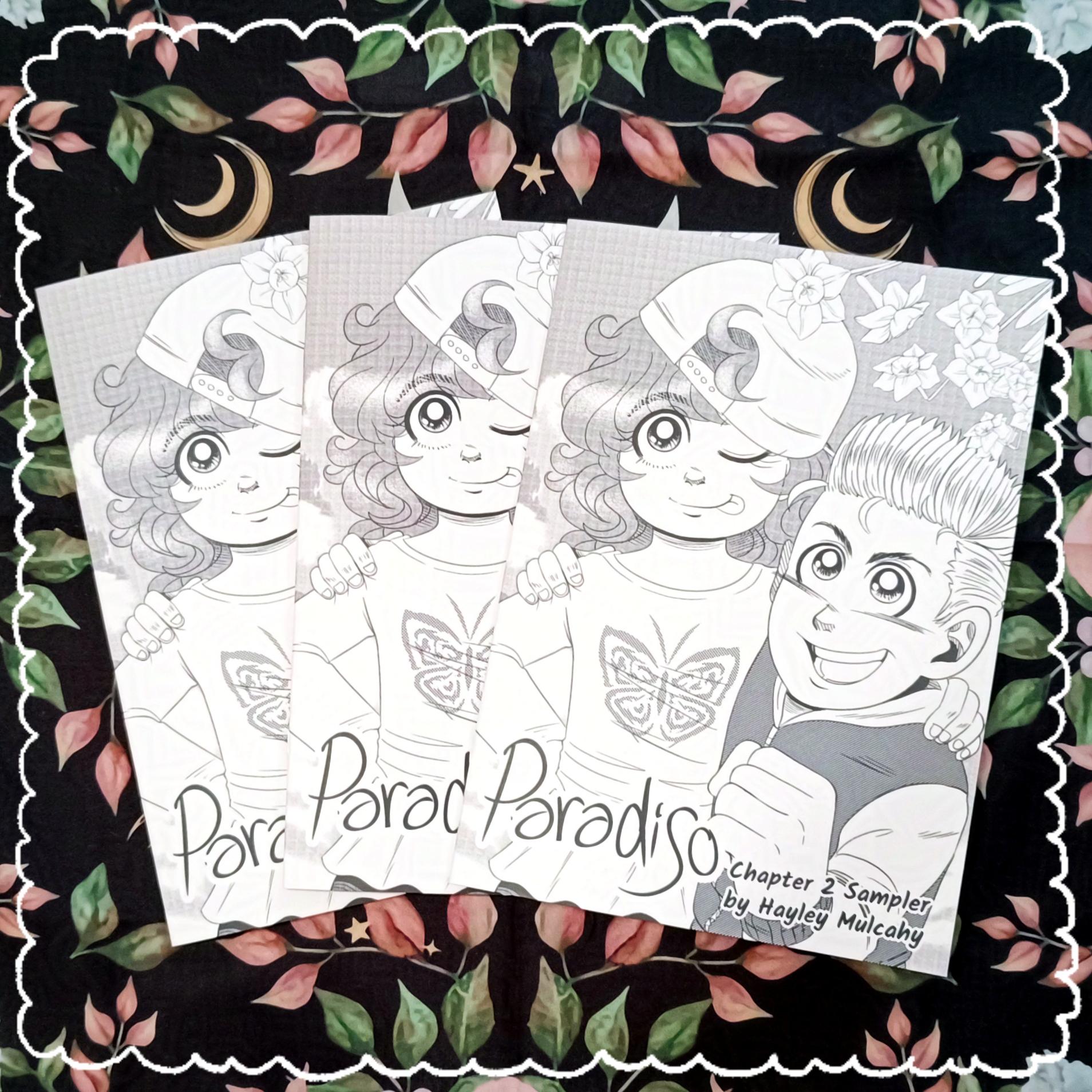 Photo of 3 copies of the Paradiso Chapter 2 Sampler. It features the characters Tiffany and Connor on the cover. It's in black and white greyscale with screen tones.